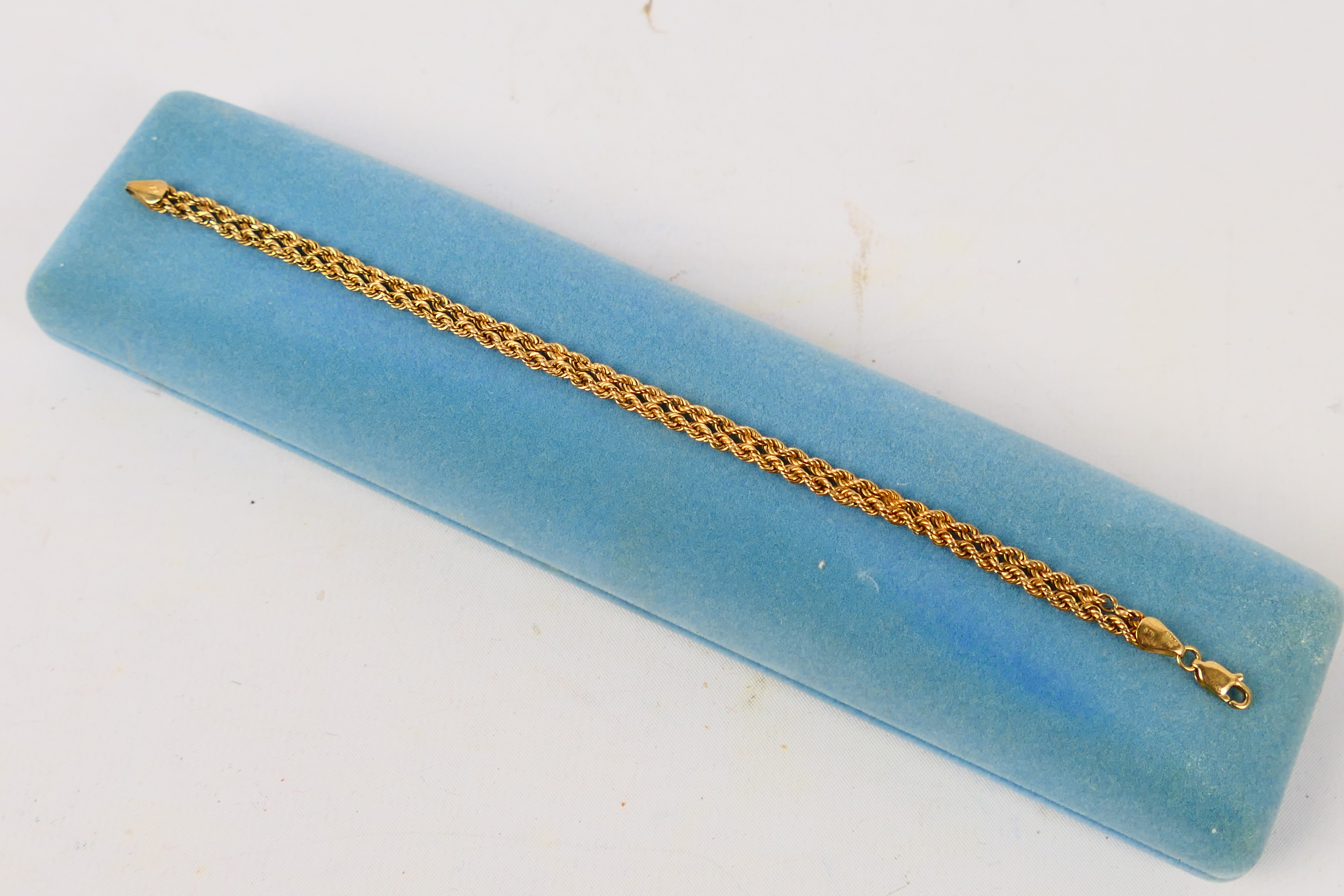 A 9ct yellow gold rope twist bracelet, 19 cm (l), approximately 3 grams.