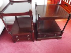 Two small dark wood tables with drawers below,