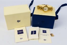 A gold plated Raymond Weil Fidelio wrist watch, contained in original box with paperwork.