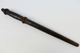 A 19th century turned wood truncheon, approximately 42 cm (l).