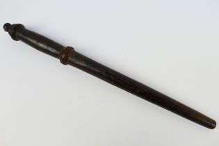 A 19th century turned wood truncheon, approximately 42 cm (l).