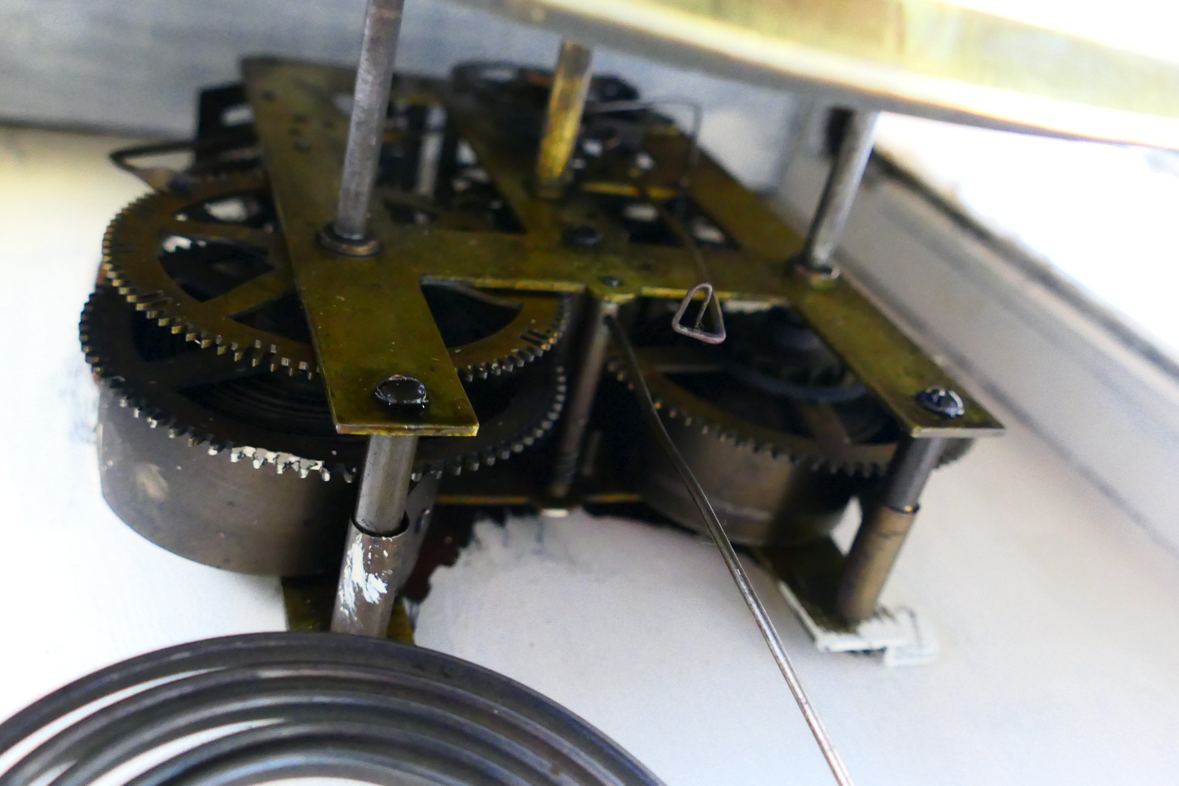 A white painted wall clock, Roman numerals to a white dial, with key and pendulum. - Image 8 of 8