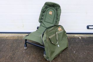 A Carp Kinetics folding fishing chair contained in carry case.