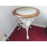 A 19th century cast iron Britannia Pub Table with pierced undershelf, painted white,