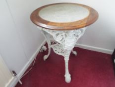 A 19th century cast iron Britannia Pub Table with pierced undershelf, painted white,
