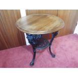 A 19th century cast iron Britannia Pub Table with pierced undershelf, painted black,