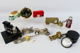 A collection of clocks, predominantly transport related novelty examples.