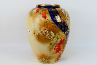 A large vase with floral and gilt decoration, approximately 40 cm (h).