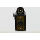 A Coronet Midget 16 mm subminiature camera, black bakelite case, 6.5 cm (h).