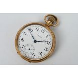 A gold plated open face pocket watch, white enamel dial with Arabic numerals,