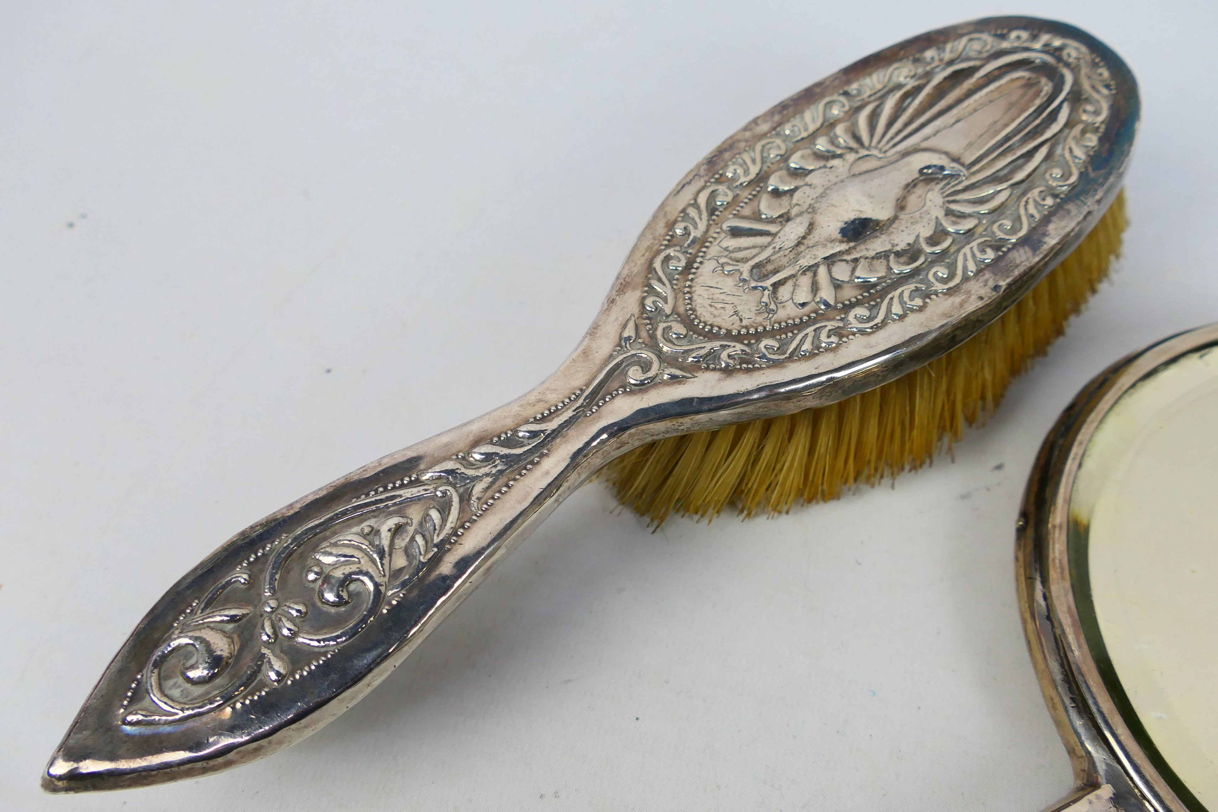 White metal mounted dressing table items comprising a hand mirror and brush with embossed - Image 7 of 8