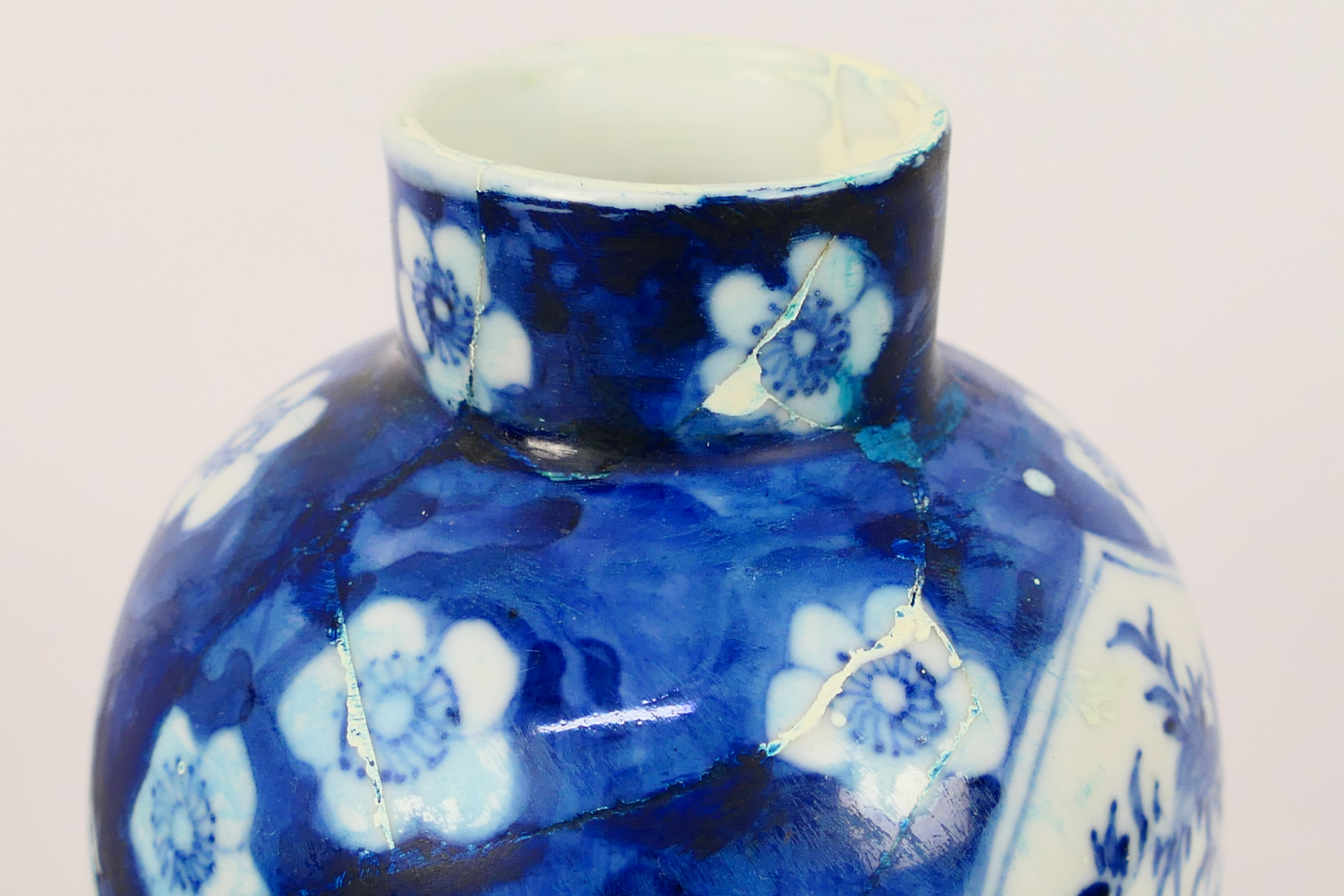 A Chinese blue and white jar and cover, decorated with prunus, - Image 16 of 23