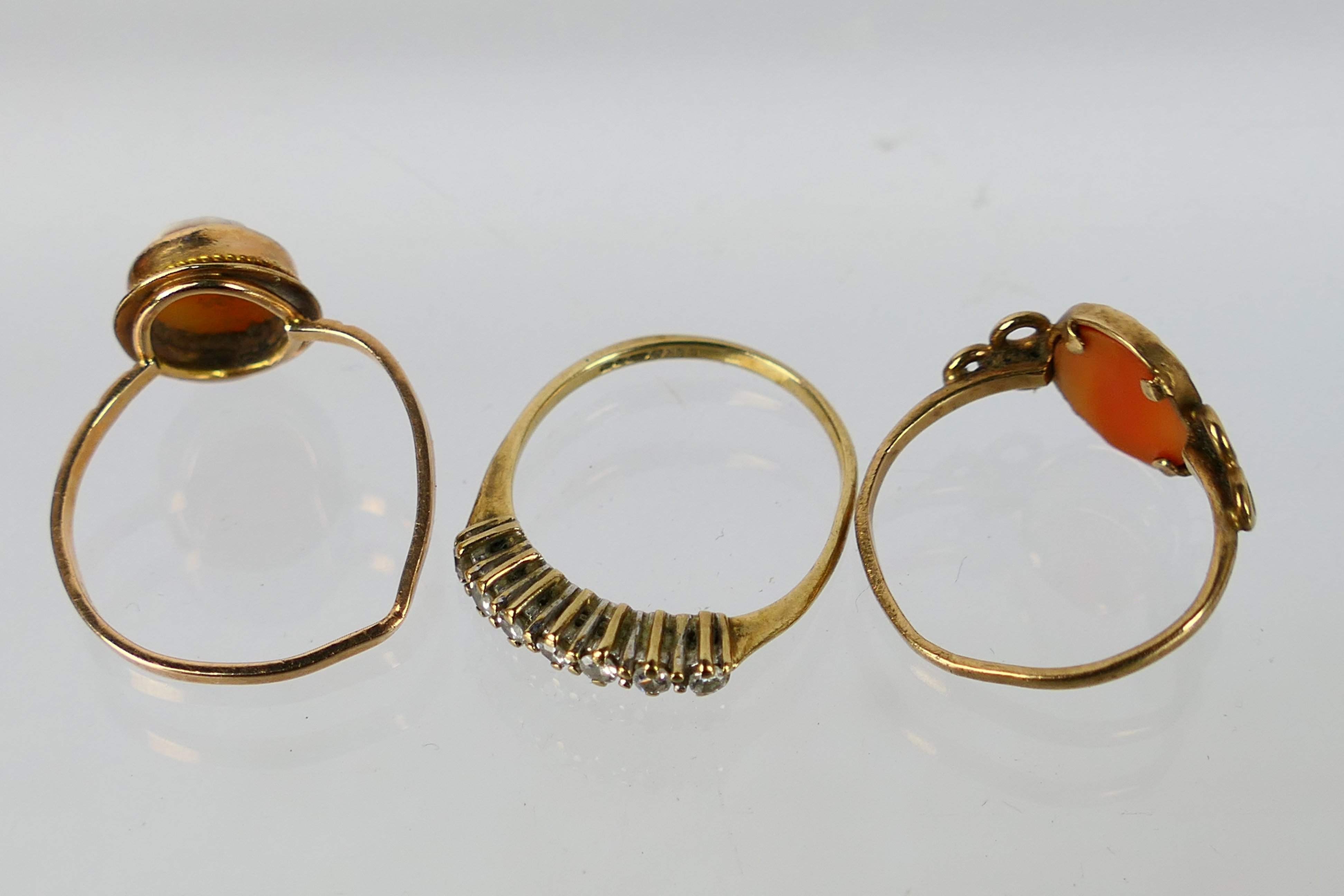 Three 9ct gold rings (all with misshapen shanks) comprising two cameo rings and one set with seven - Image 5 of 5