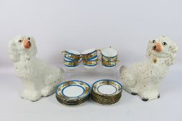 A pair of Staffordshire dogs in white and gilt,
