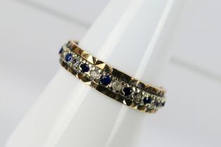 A 9ct gold and sapphire eternity ring, set with alternating white and blue sapphires, size P+½,