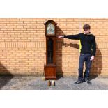 An early 20th century, oak cased grandmother clock, glazed door,