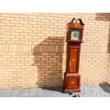 An interesting 8-day brass dial longcase clock,