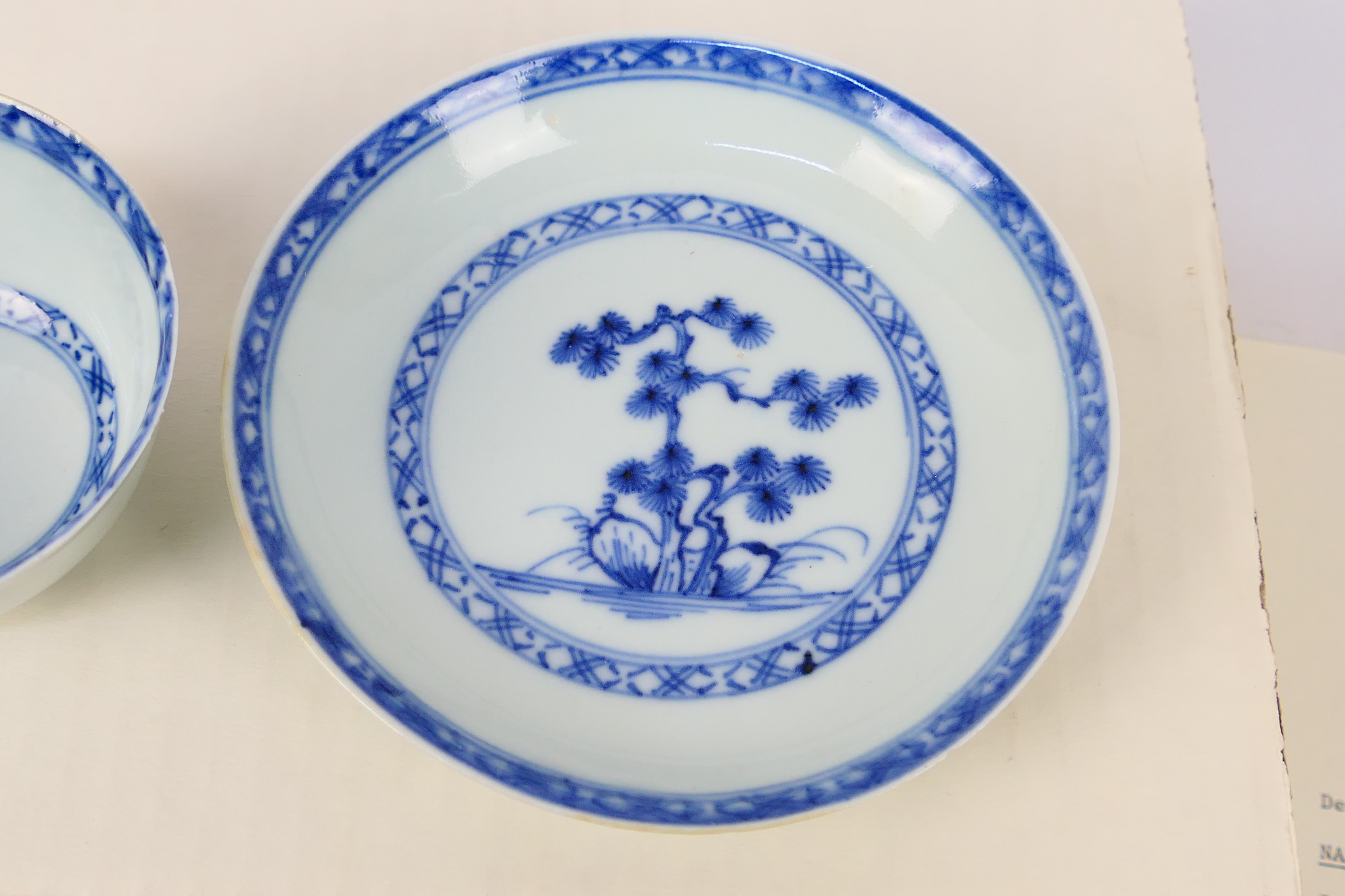 Nanking Cargo - A Qing dynasty blue and white tea bowl and saucer decorated with pine trees, c. - Image 4 of 9