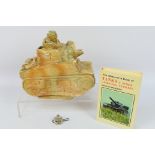 A ceramic model depicting a stylised French tank,