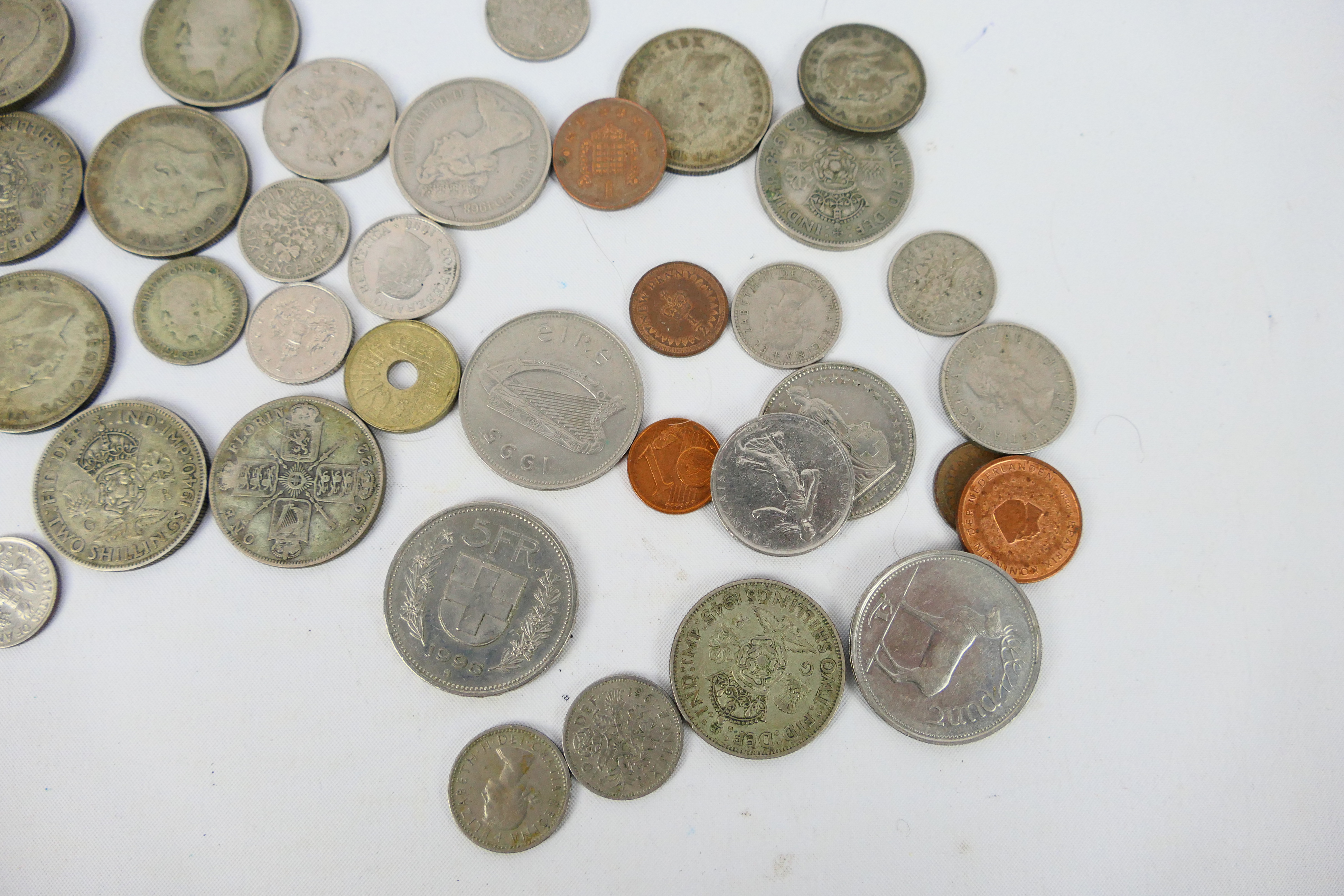 A small quantity of UK and foreign coins, some silver content. - Image 6 of 6