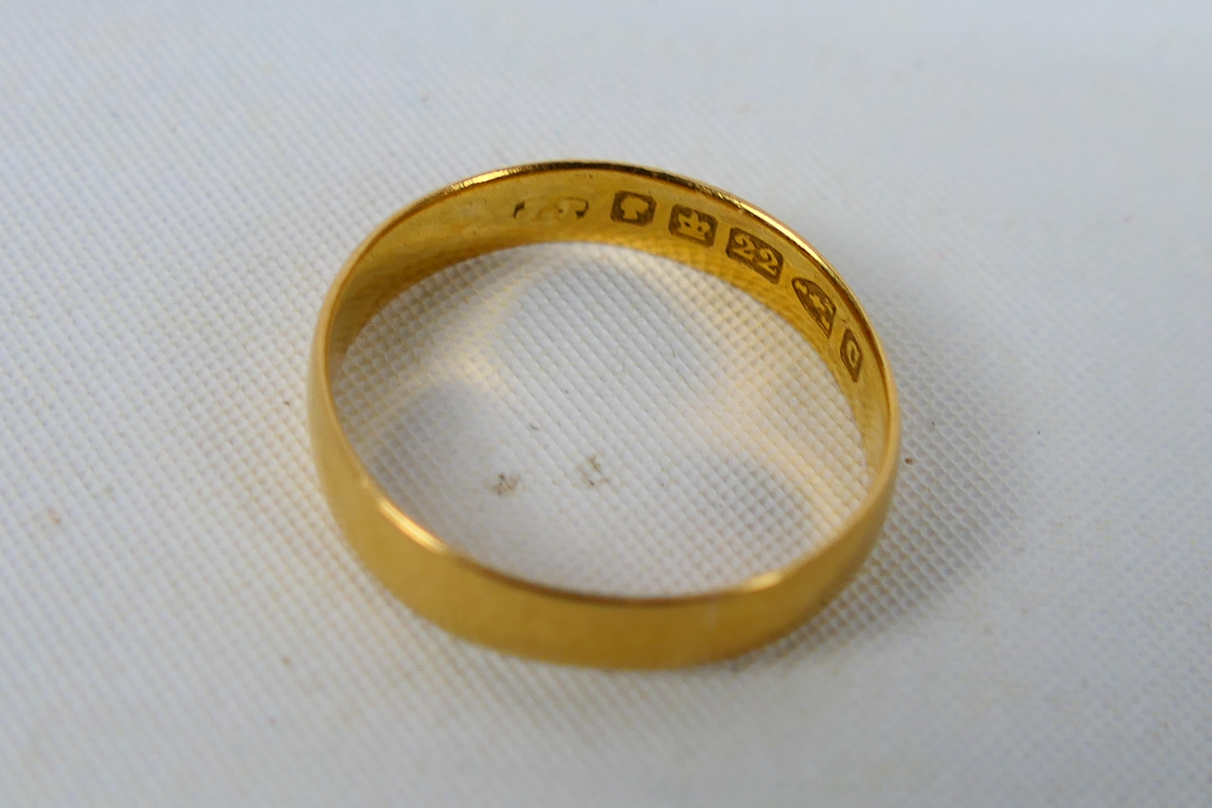 A Victorian 22ct yellow gold wedding band, Chester assay 1886, size L, 2.1 grams.