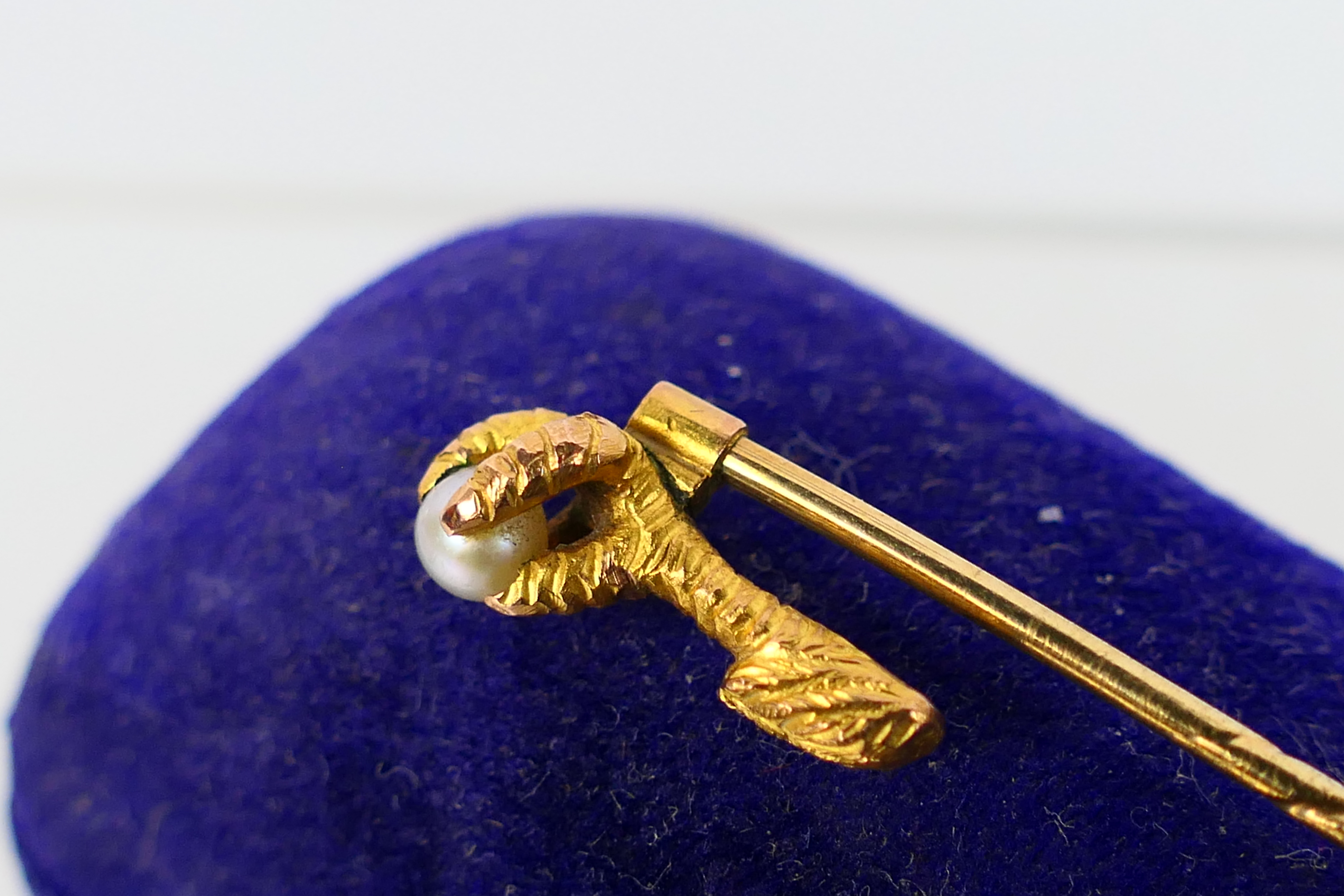 A Victorian yellow metal and pearl stick pin, formed as a bird's talon clutching the pearl, - Image 3 of 9
