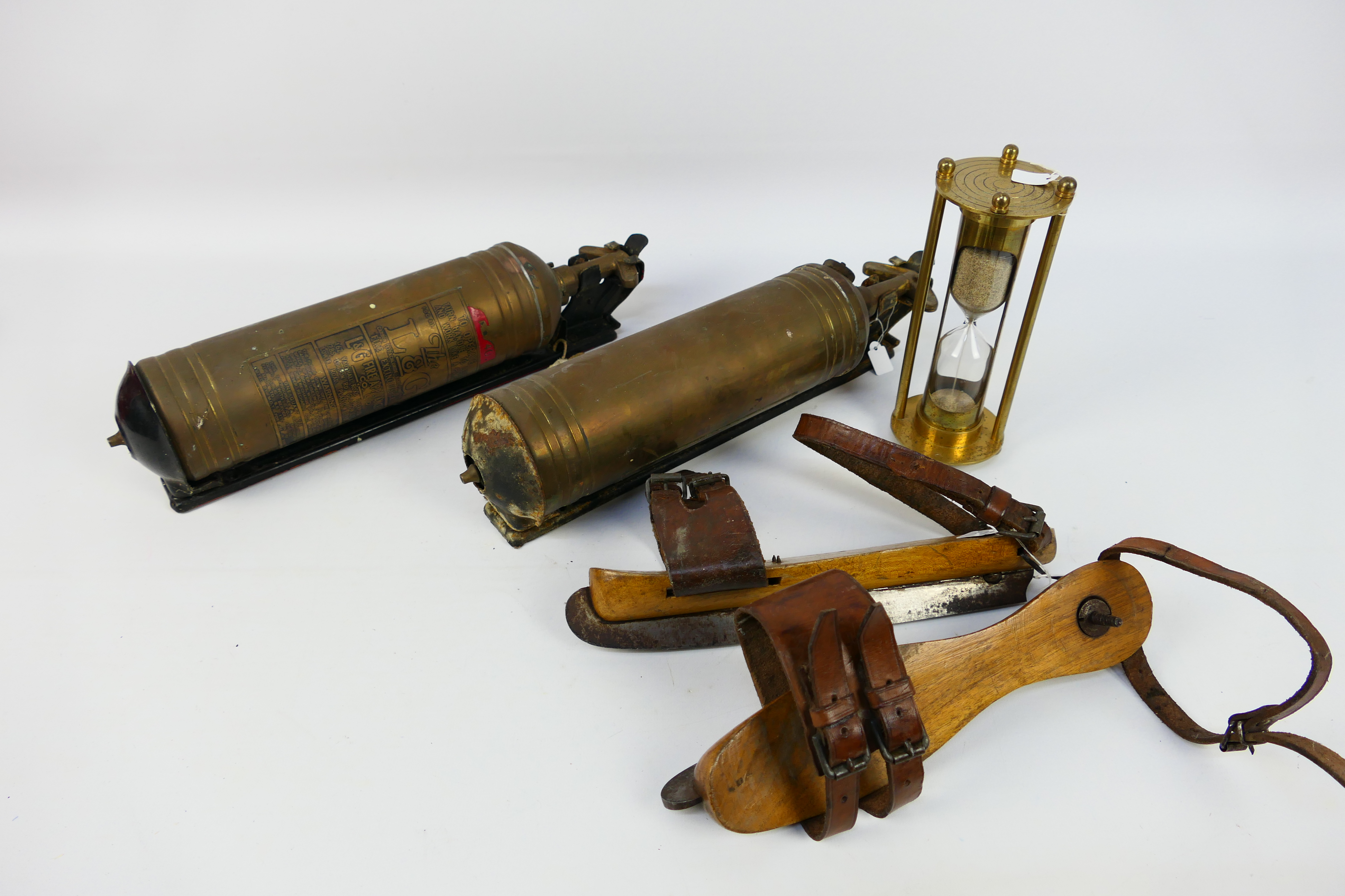 Vintage collectables to include two brass fire extinguishers, ice skates and other.