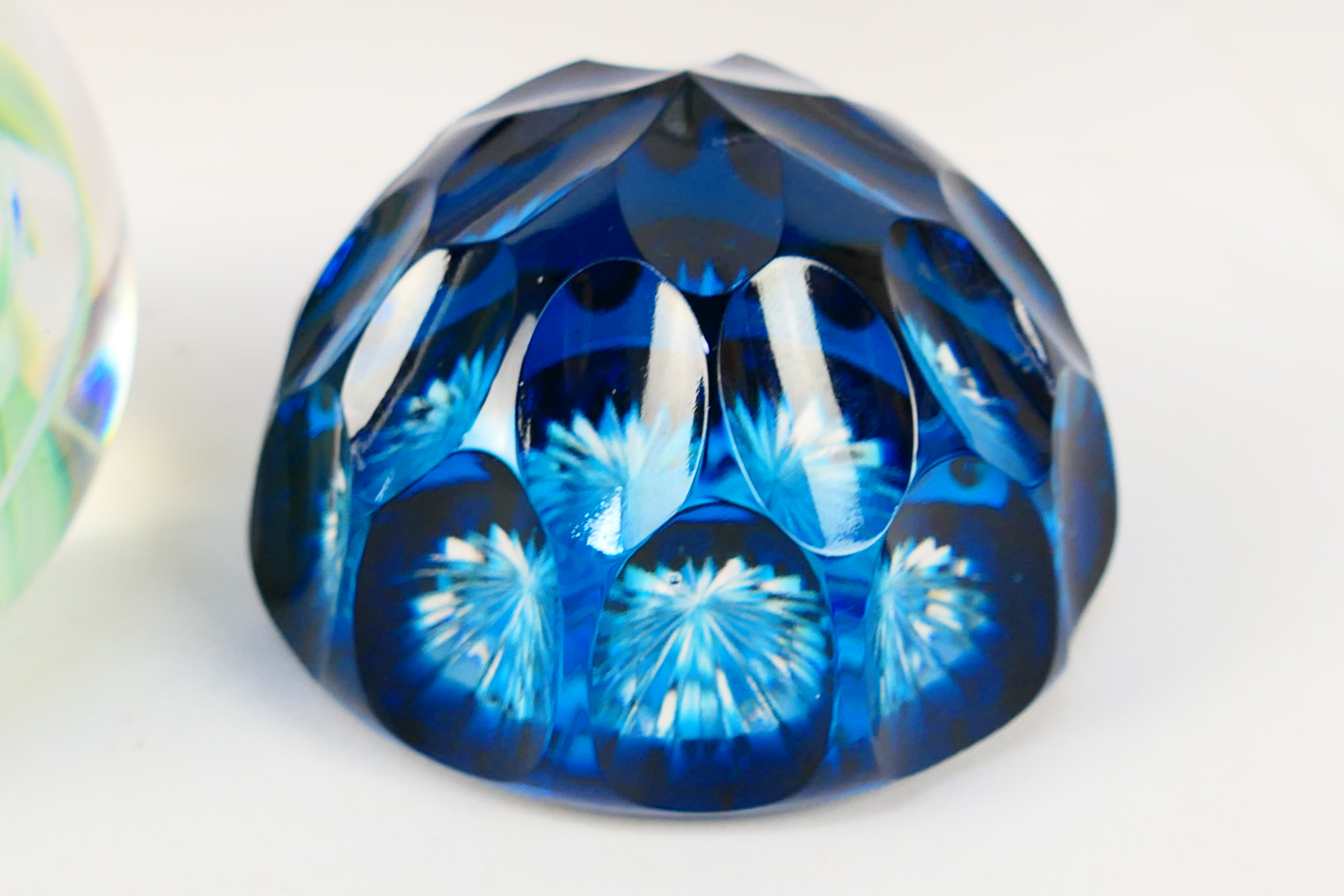 Four decorative paperweights, one with faceted blue glass, Caithness style and similar. - Image 5 of 5