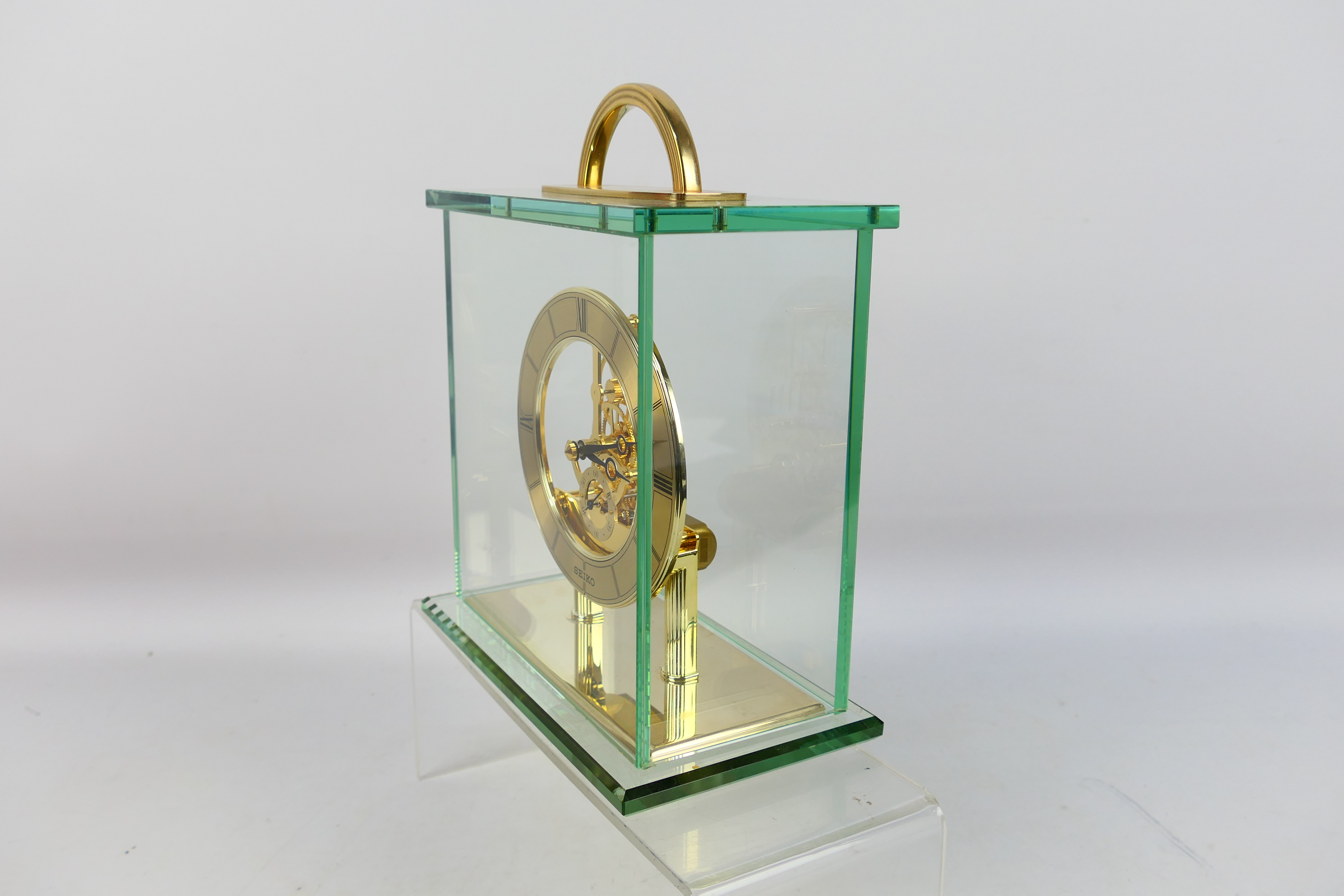 Seiko - A glass cased skeleton clock with quartz movement, 24 cm (h) to top of handle. - Image 4 of 6