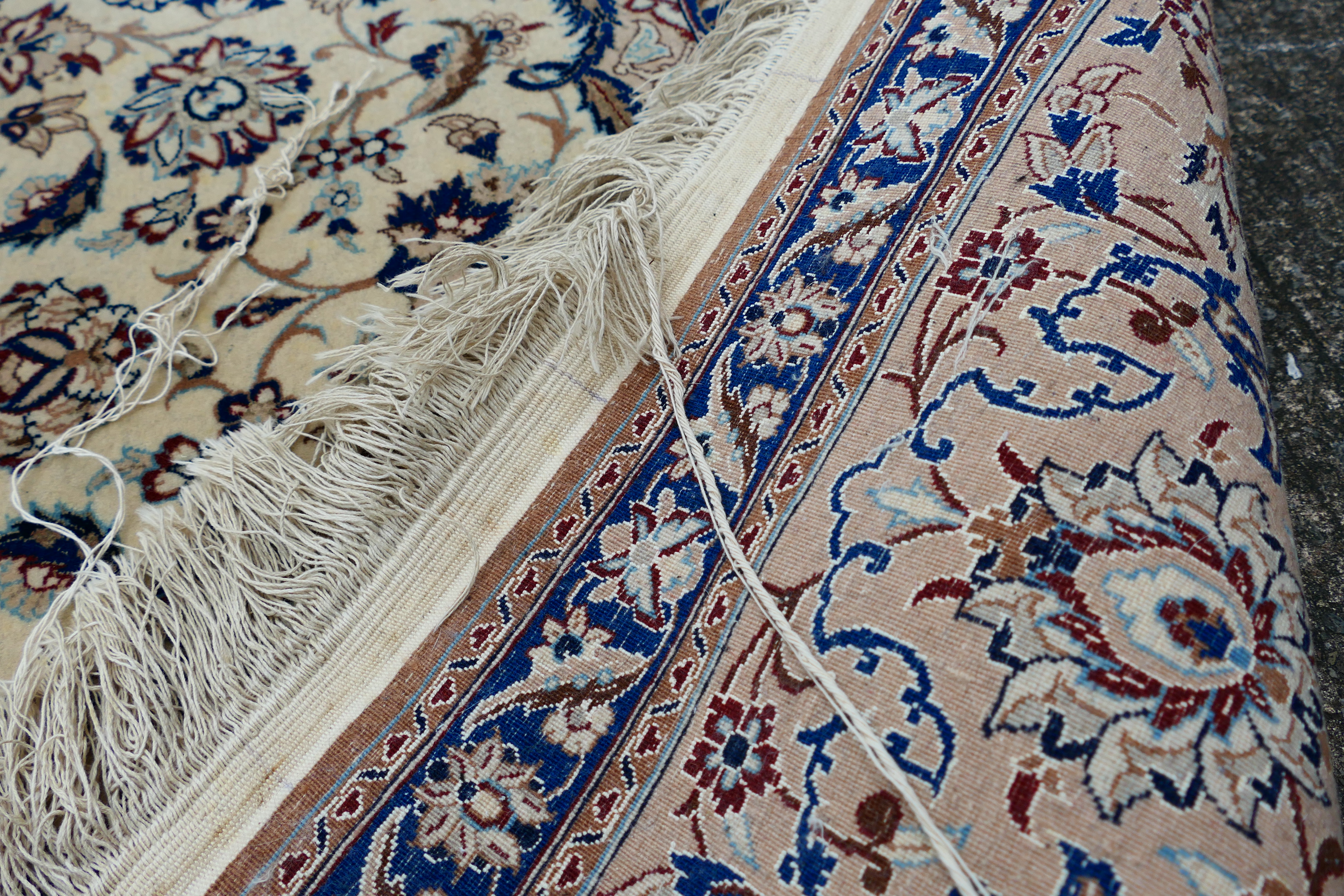A Persian ivory ground rug with central medallion on a floral field, with foliage scroll border, - Image 9 of 14