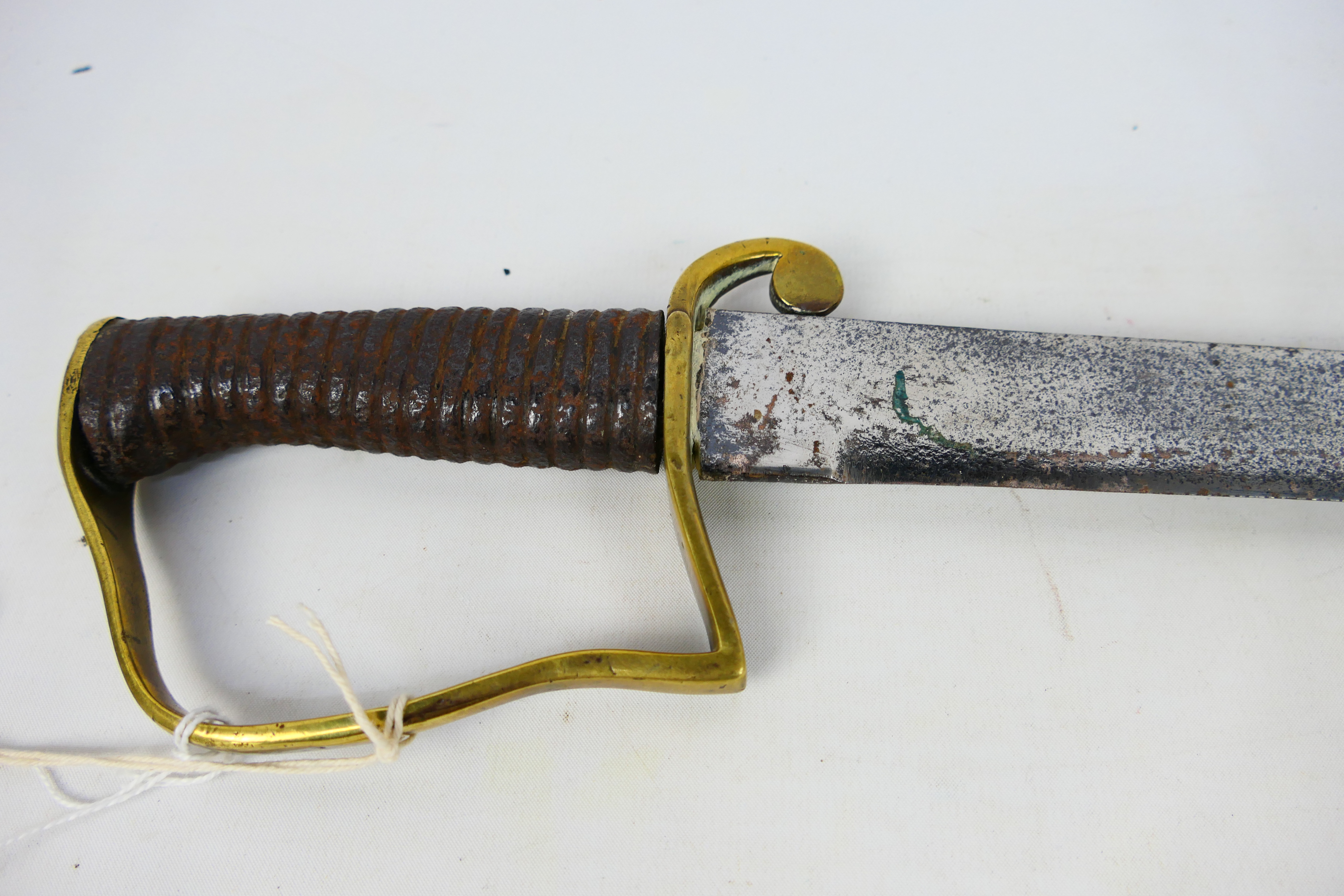 An 1896 pattern Mountain Artillery Sabre style sword, brass stirrup hilt and ribbed iron grip. - Image 3 of 7