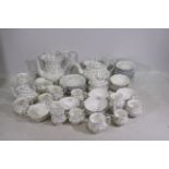 Royal Albert - A collection of tea wares in the Caroline pattern including teapot, coffee pot, cups,