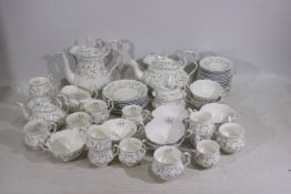 Royal Albert - A collection of tea wares in the Caroline pattern including teapot, coffee pot, cups,