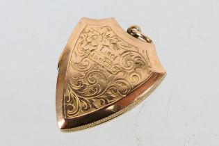 A 9ct rose gold locket of shield form, 2.6 cm (l), approximately 3 grams.