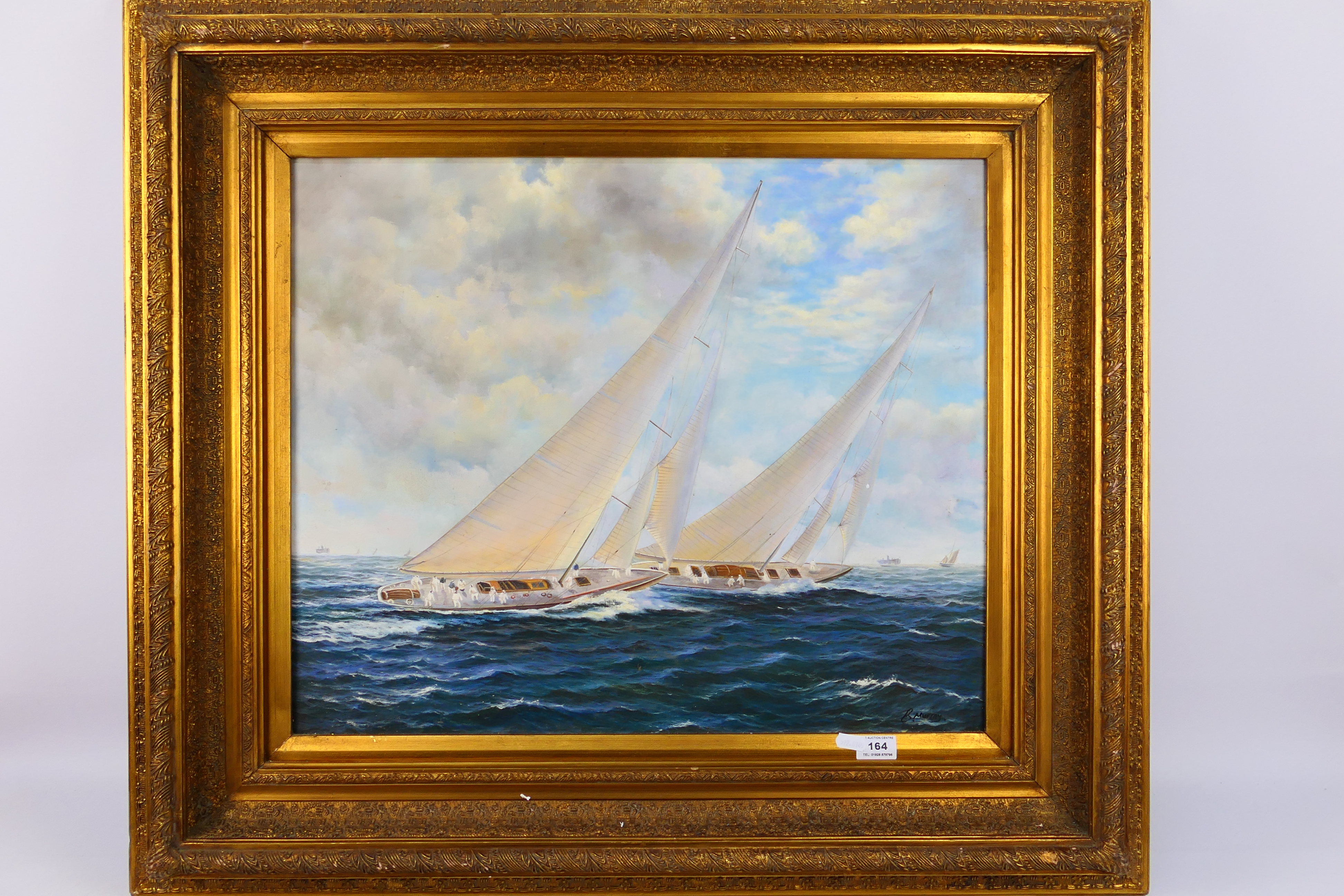 A 20th century oil on canvas seascape, depicting two racing yachts at sail,