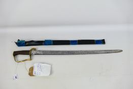 An 1896 pattern Mountain Artillery Sabre style sword, brass stirrup hilt and ribbed iron grip.