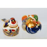 Royal Crown Derby - Two paperweights comprising Mandarin Duck and Goldfinch Nesting, gold stoppers,