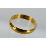 A 22ct gold wedding band, size O, approximately 2.9 grams.