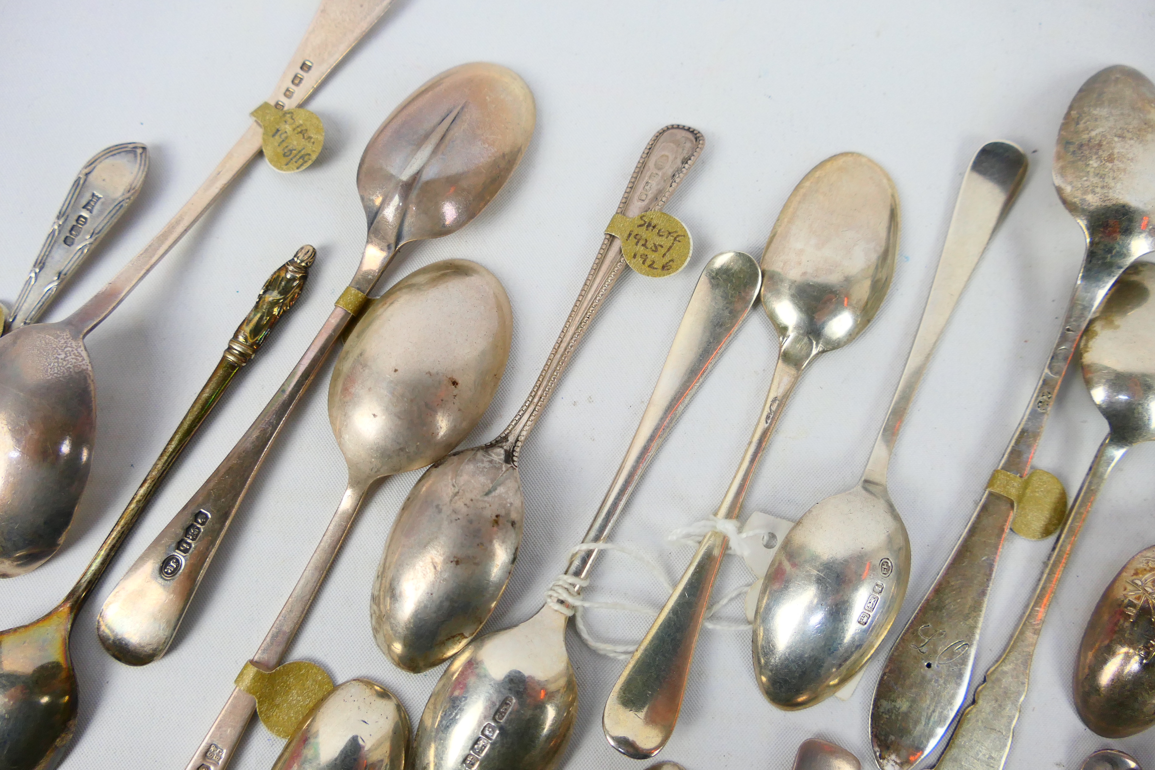 A collection of silver spoons, various assay and date marks, approximately 282 grams / 9 ozt. - Image 9 of 11
