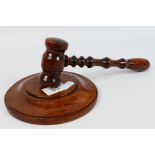 A turned wood gavel and block. [2].