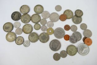 A small quantity of UK and foreign coins, some silver content.