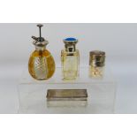 A group of silver mounted dressing table items comprising scent bottle with silver and enamel lid,