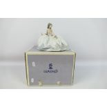 Lladro - A boxed figure entitled At The Ball, # 5859, approximately 15 cm (h).