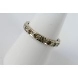 A white metal, diamond set eternity ring, marks quite rubbed but appears to be stamped 9ct,