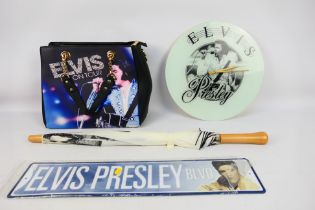 Elvis - A collection of items relating to Elvis Presley to include road sign, glass wall clock,