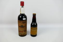 A bottle of G & J Greenall Top Dog Fine Old Demerara Rum, no strength or capacity stated,