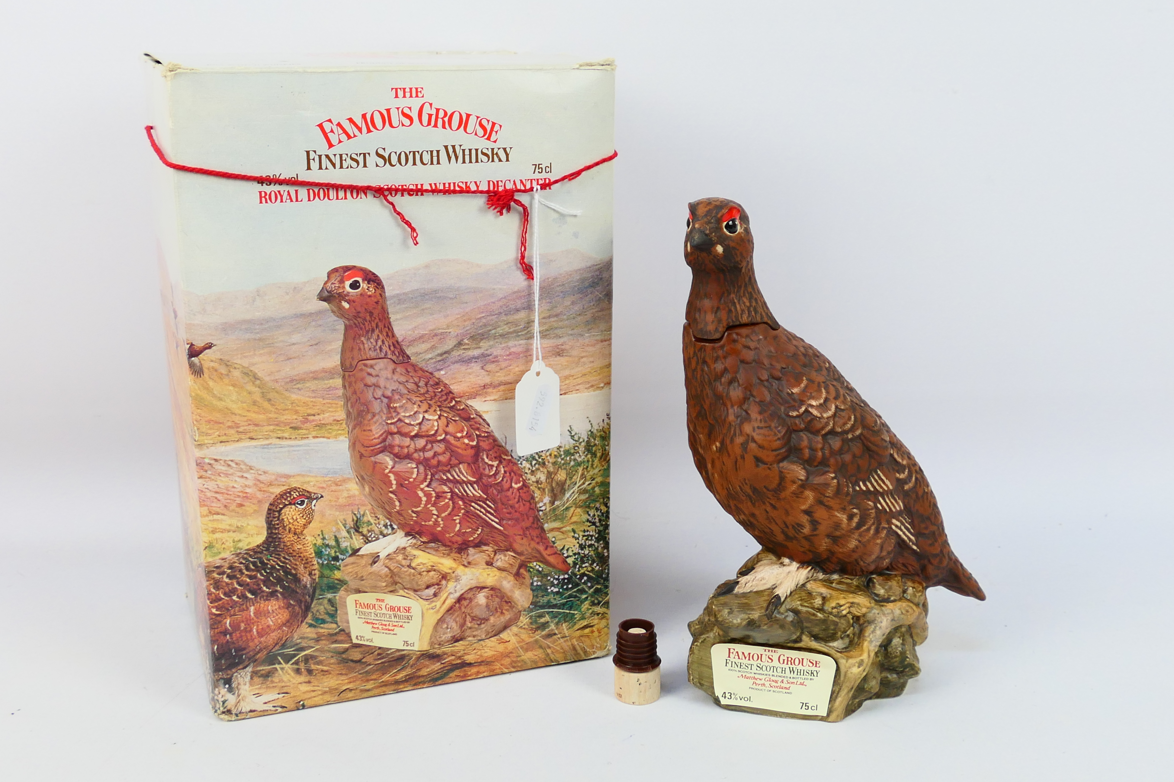 Famous Grouse - A ceramic Royal Doulton grouse form decanter containing 75cl of Famous Grouse
