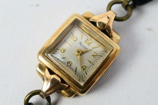 A 9ct gold cased Rotary wrist watch on black leather strap.