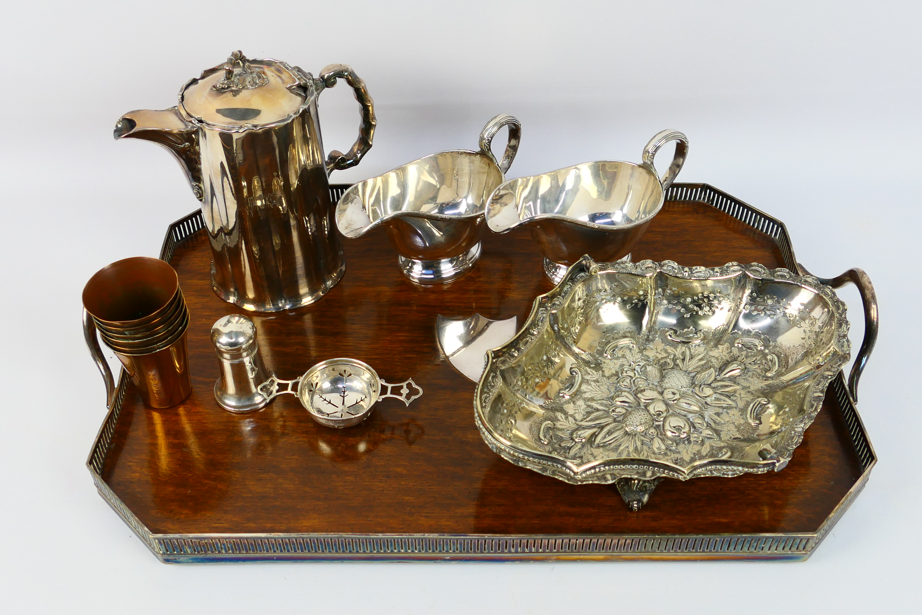 A collection of predominantly silver plated gravy jugs, dish, 2 x jugs, serving tray,