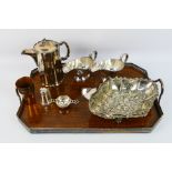 A collection of predominantly silver plated gravy jugs, dish, 2 x jugs, serving tray,